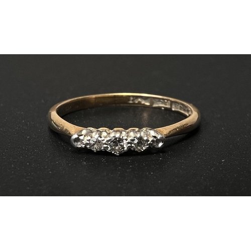 640 - A yellow metal ring stamped '18ct', set 5 small graduating diamonds, size 'N', 2gm