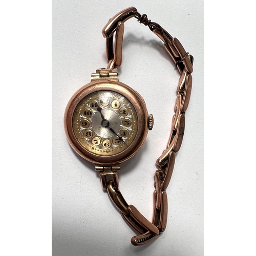 651 - An Edwardian lady's 9 carat hallmarked gold wristwatch on yellow metal expanding bracelet, stamped '... 