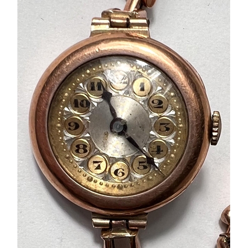 651 - An Edwardian lady's 9 carat hallmarked gold wristwatch on yellow metal expanding bracelet, stamped '... 