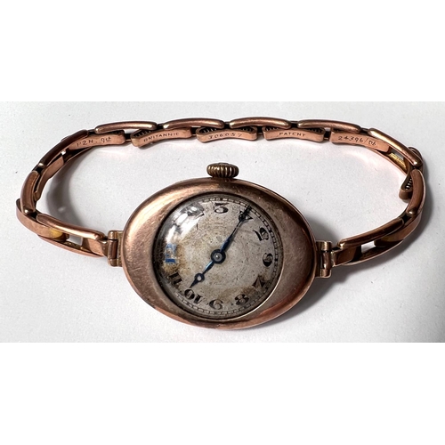 652 - An Edwardian lady's 9 carat hallmarked gold wristwatch on yellow metal strap, stamped '9ct', 20.3gm ... 