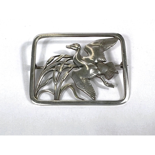 661 - Georg Jensen:  a rectangular openwork brooch with duck flying over bulrushes, numbered 300, sta... 