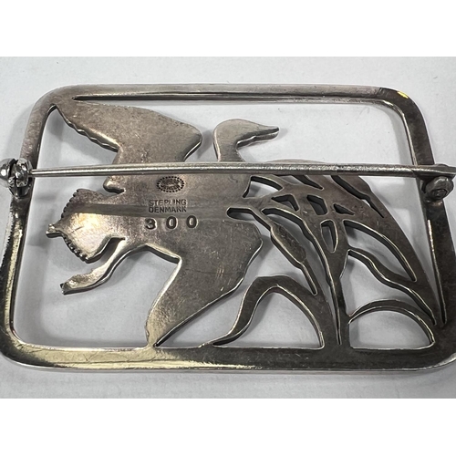 661 - Georg Jensen:  a rectangular openwork brooch with duck flying over bulrushes, numbered 300, sta... 