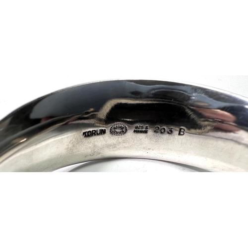 663 - Georg Jensen:  a tapering silver bangle, designed by Vivianna Torun, the swivel top set large s... 