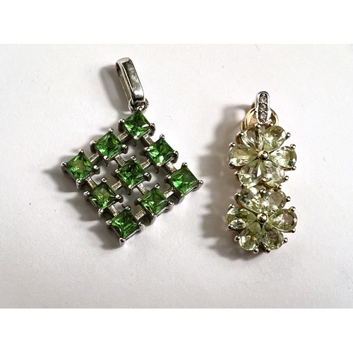 677 - A 9 carat white gold openwork diamond shaped, set 9 green stones; a 9 carat gold pendant set colour ... 