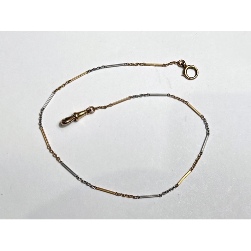 738 - A fine 2 colour chain with clip and ring, stamped '18', 8gm gross