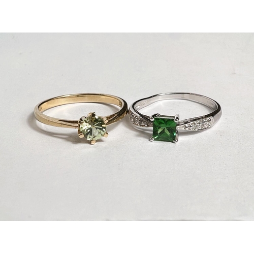 743 - A 9 carat hallmarked gold dress ring set pale green circular peridot, size N; a 9 carat hallmarked w... 