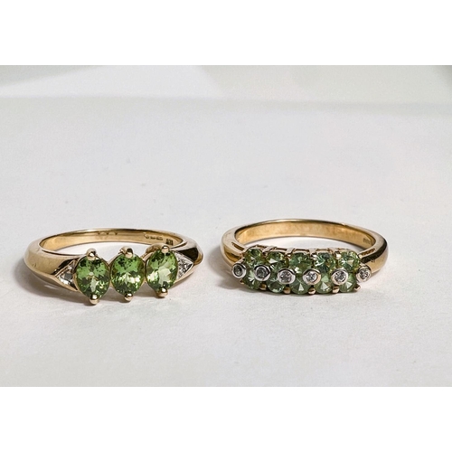 744 - A 9 carat hallmarked gold dress ring set 3 pale green peridot colour oval stones, size N; a 9 carat ... 