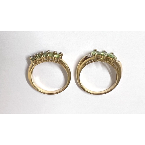 744 - A 9 carat hallmarked gold dress ring set 3 pale green peridot colour oval stones, size N; a 9 carat ... 