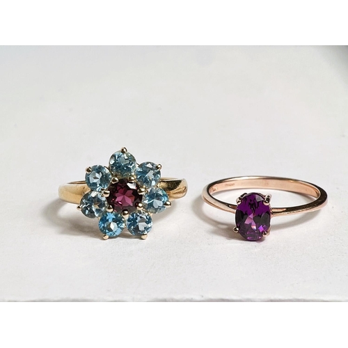 746 - A 9 carat hallmarked gold dress ring with pale blue and pink stones in flowerhead setting, size N; a... 