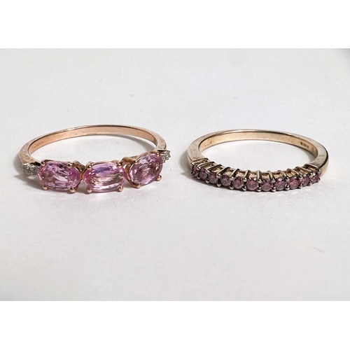 747 - A 9 carat hallmarked gold half eternity style ring set band of pink sapphires, size N; a 9 carat hal... 