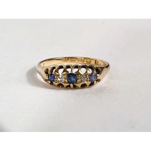 765C - An 18ct hallmarked gold ring with 3 sapphires and 2 small diamonds in split shank setting 3.1gm, siz... 