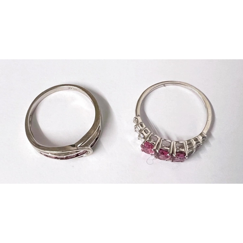 776A - A 9ct hallmarked white gold ring set with a band of pink stones testing Morganite with gold looping ... 