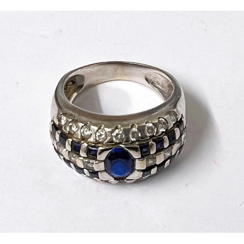 778A - A white ....... ct hallmarked white gold ring set with central blue stone with blue and clear stones... 