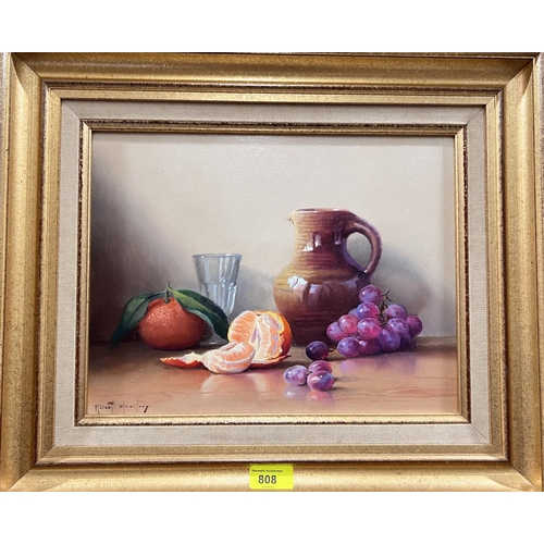 808 - Robert Cailloux 1913:  oranges and grapes in an earthenware jug, oil on board, signed, 25 x 33cm, fr... 