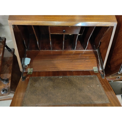 872 - A reproduction mahogany bureau with fall front and 3 drawers