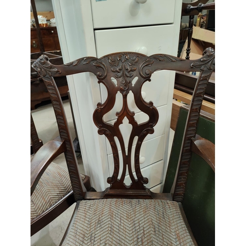 943 - A 19th century mahogany set of 8 (6 + 2) Chippendale style dining chairs, with extensive carved deco... 