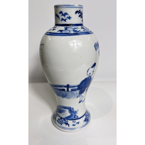 428 - A Chinese blue and white inverted baluster vase, decorated with traditional figures four character m... 