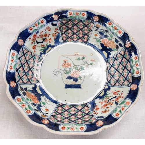 435 - A 19th century Japanese Imari dish with scalloped and lobed edges floral decoration, circle marks to... 