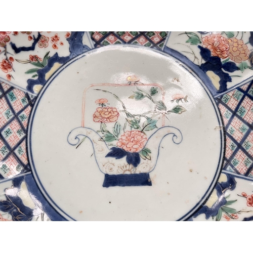 435 - A 19th century Japanese Imari dish with scalloped and lobed edges floral decoration, circle marks to... 