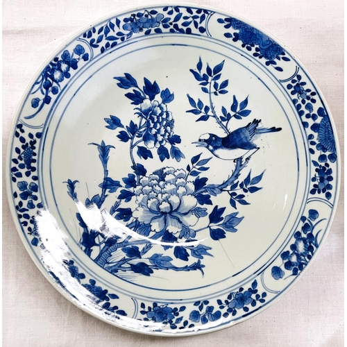 436 - A 19th century Chinese blue and white dish decorated with bird on chrysanthemum, floral border, diam... 