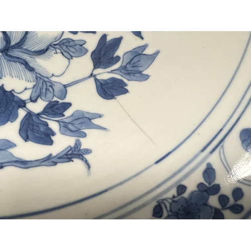 436 - A 19th century Chinese blue and white dish decorated with bird on chrysanthemum, floral border, diam... 