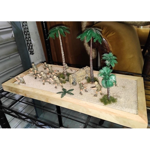 324 - A scratch built military diorama of a desert battle with troops advancing, length 46cmNo bids sold w... 