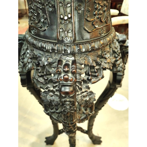 401 - A Chinese tall plant stand in carved and pierced hardwood, with inset marble top, height 97cm