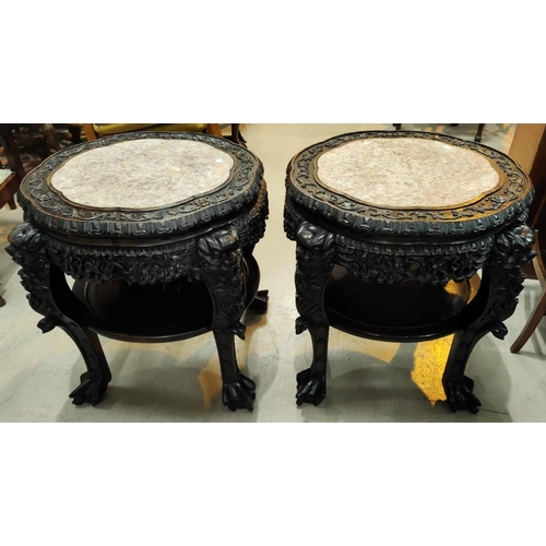 402 - A Chinese pair of large occasional tables/plant stands, carved and pierced with inset marble tops, u... 