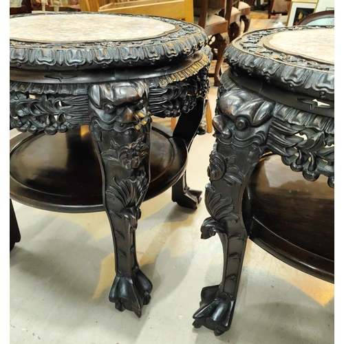 402 - A Chinese pair of large occasional tables/plant stands, carved and pierced with inset marble tops, u... 