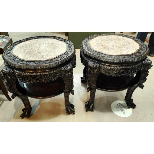 402 - A Chinese pair of large occasional tables/plant stands, carved and pierced with inset marble tops, u... 