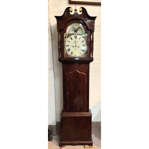 886 - An early 19th century figured mahogany long cased clock, the hood with swan neck pediment and turned... 