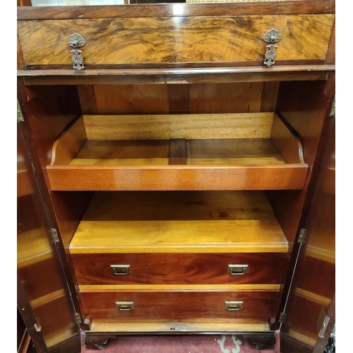 931 - A 1930's figured walnut tallboy with fitted interior, frieze drawer and double cupboard