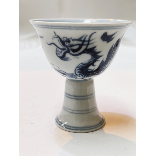 410 - A Chinese blue and white stem cup decorated in underglaze blue with dragon 6 character signature hei... 