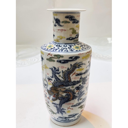 412 - A Chinese rouleau shaped vase decorated in underglaze blue and polychrome with 