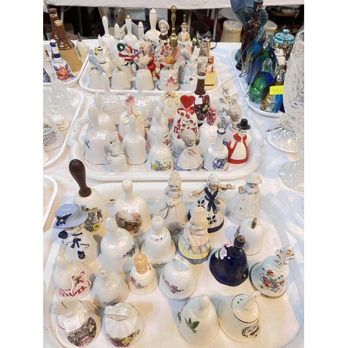 445 - A large selection of ceramic and other bells with animal finials etc