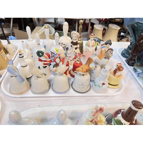 445 - A large selection of ceramic and other bells with animal finials etc