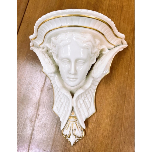 577 - A ceramic cherub head wall bracket