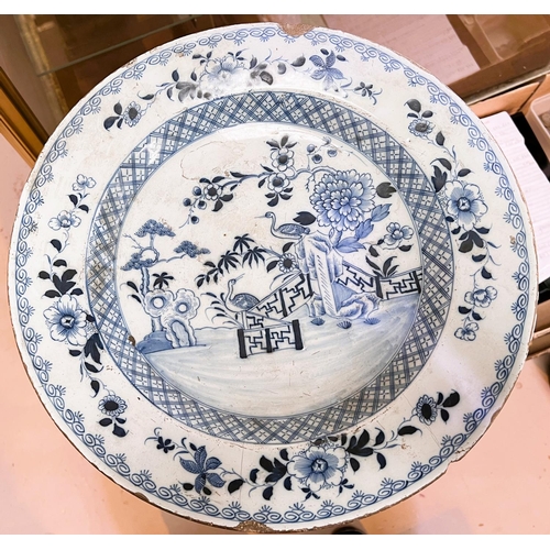 598 - An 18th century tin glazed dish with Chinese style decoration, for import/export, diameter 36cm