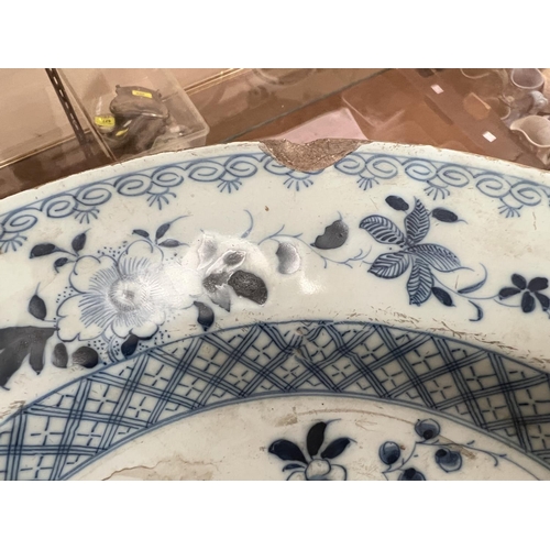 598 - An 18th century tin glazed dish with Chinese style decoration, for import/export, diameter 36cm