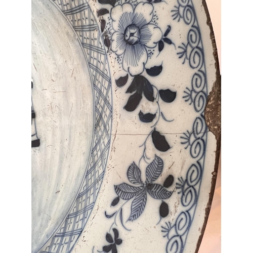 598 - An 18th century tin glazed dish with Chinese style decoration, for import/export, diameter 36cm