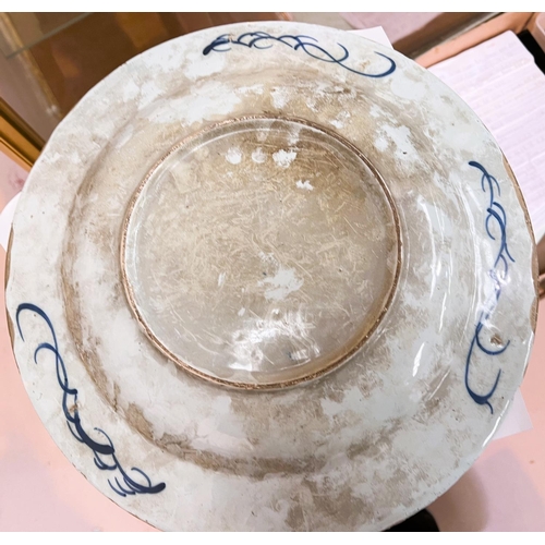 598 - An 18th century tin glazed dish with Chinese style decoration, for import/export, diameter 36cm