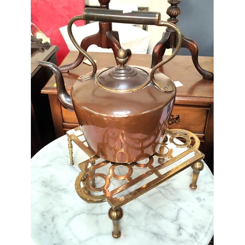 1 - An Art Nouveau embossed brass plant stand; 2 brass trivets; a copper kettle