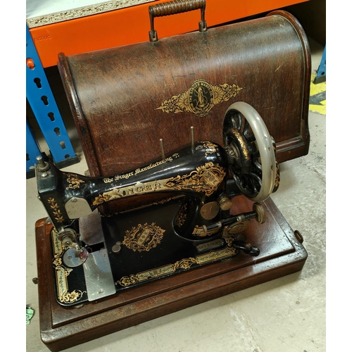 20 - A vintage domed cased sewing machine