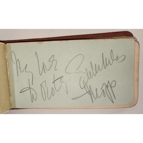 397 - An autograph album containing a selection of mid 20th century autographs