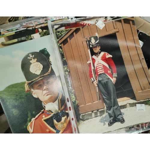 45 - A selection of battle re-enactment photos and cards; a box of albums for postcards