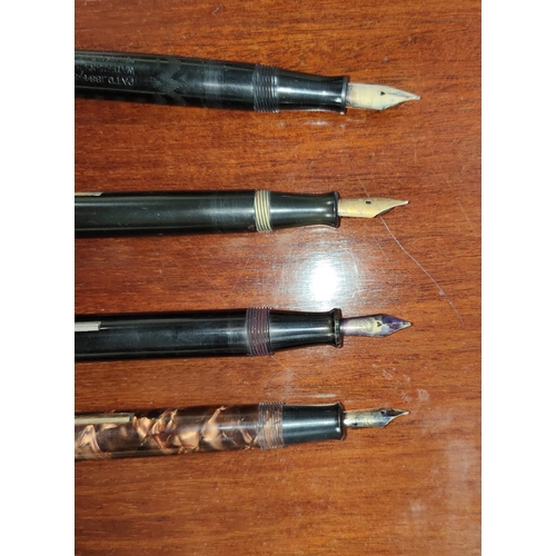 55C - Four vintage fountain pens, Swan Self Filler, a Waterman's, and two other similar