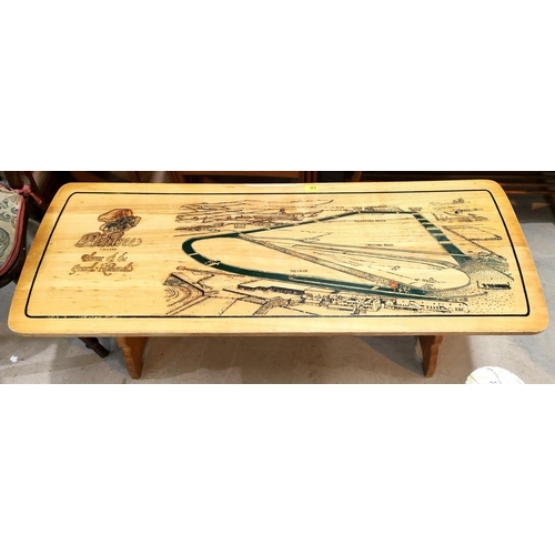 830 - A Priory furniture light wood coffee table with top decorated with Aintree Racecourse etc