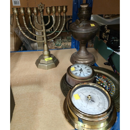 169 - A brass Menorah  on octagonal base, a brass oil lamp etc