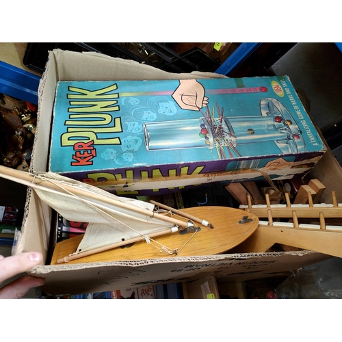 200 - A vintage Sailboat and vintage games including Kerplunk etc