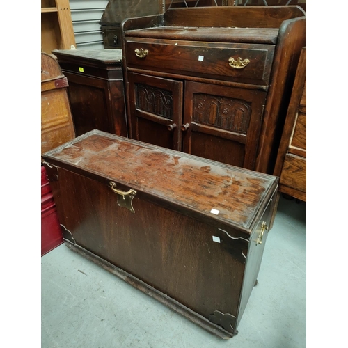 824 - A 1930's oak bureau with cabinet under;  a carved oak side cabinet; a small oak effect chest.